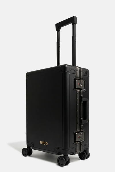 FLYCO black aluminium luggage — three-quarter view