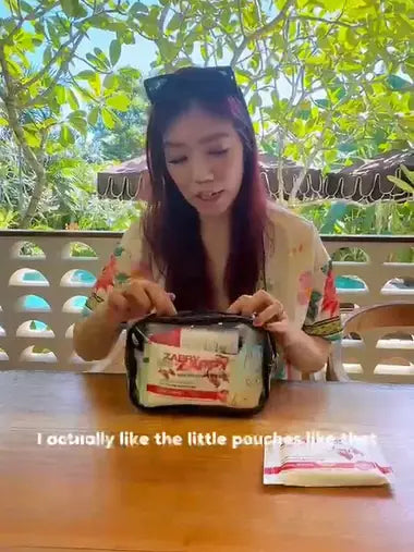 Creator opening a branded welcome kit on location